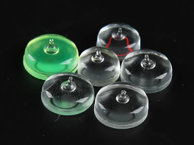 There are two transparent glass circular bubble level vials with tip.