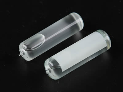 Two glass tubular bubble level vials with one smooth and the other is frosted.